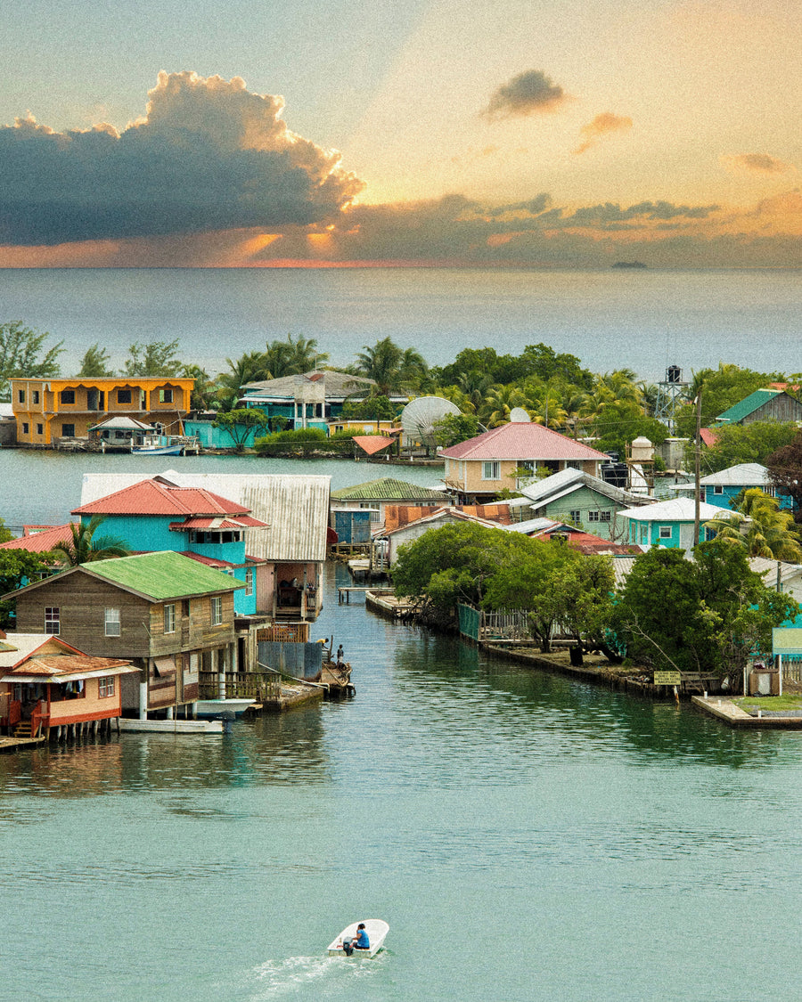 An island harbor under gathering clouds