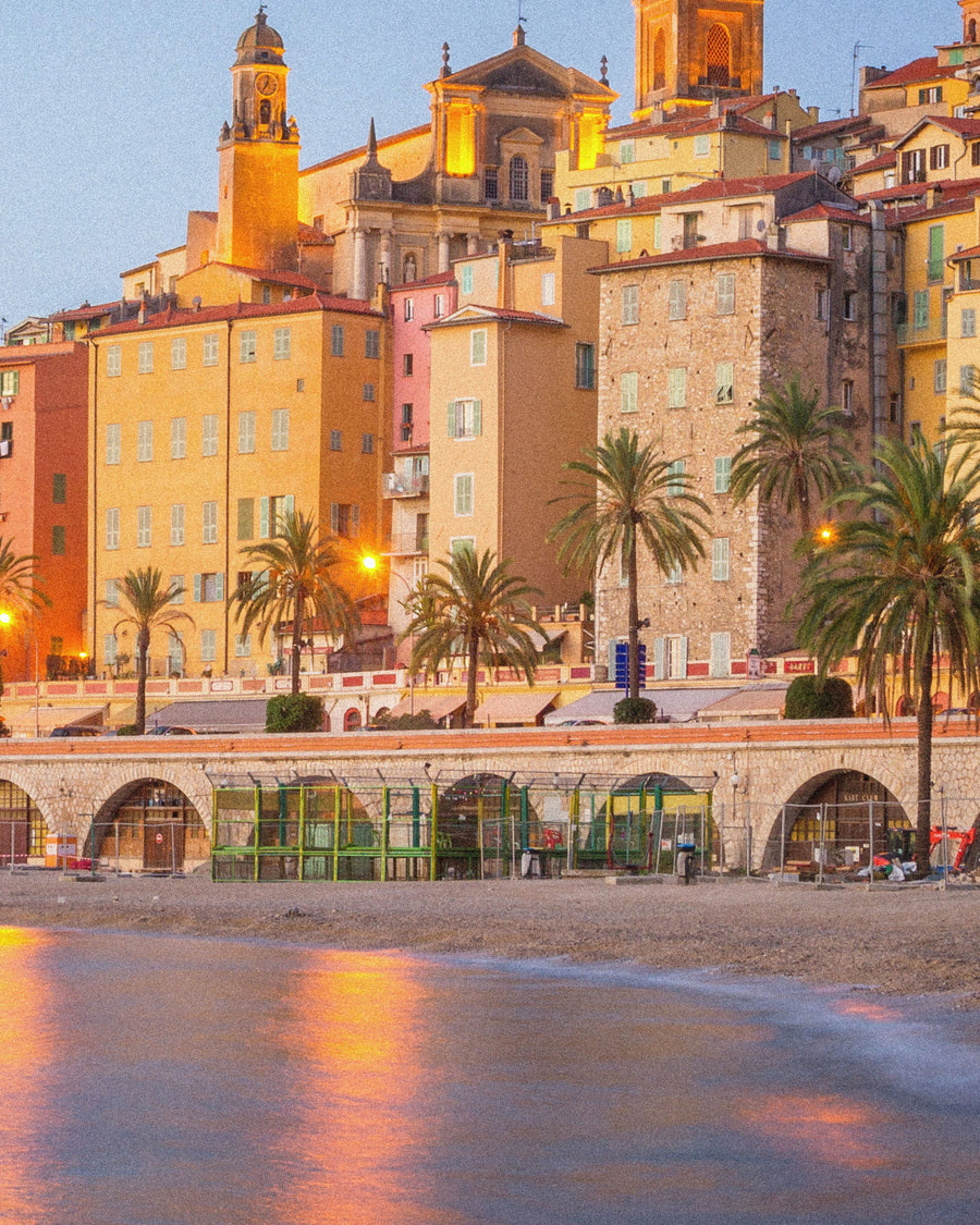 A Riviera old town glowing at dusk
